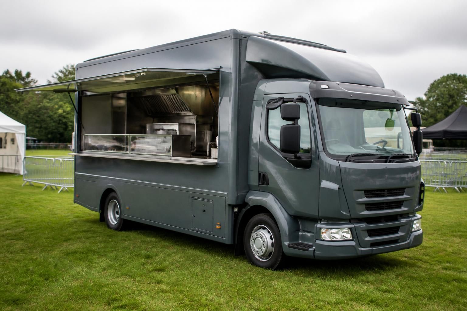 Catering lorry with its serving hatch open at an outdoor event